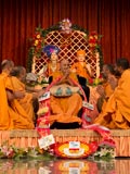  Sadhus honor Swamishri with a garland
