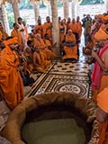  Swamishri with sadhus beneath the mandir dome