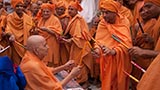 Swamishri in a festive mood with sadhus in the mandir pradakshina