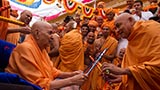  Swamishri in a festive mood with sadhus in the mandir pradakshina