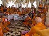  Swamishri with sadhus beneath the mandir dome