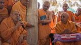  Swamishri with sadhus beneath the mandir dome