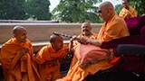  Swamishri blesses sadhus in the mandir pradakshina with the peace stick