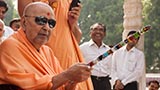  Swamishri blesses sadhus in the mandir pradakshina with the peace stick