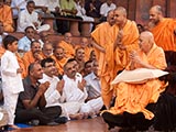  Swamishri blesses a kid