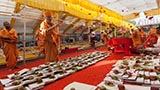  Senior sadhus perform pujan of account books by showering sanctified flower petals, rice grains, abil and gulal