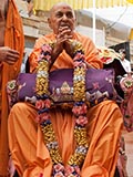  Senior sadhus honor Swamishri with a garland