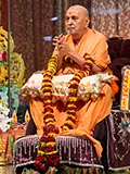  Senior sadhus honor Swamishri with a garland