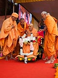  Senior sadhus honor Swamishri with a garland