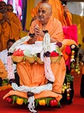  Senior sadhus honor Swamishri with a garland