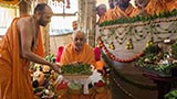  Swamishri holding various fruits and vegetables offered to Thakorji