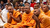 Sadhus and devotees doing darshan of Swamishri