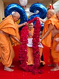  Senior sadhus honor Swamishri with a garland