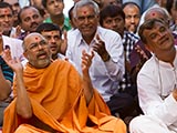 Sadhus and devotees doing darshan of Swamishri