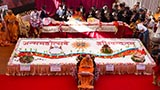  Swamishri greets devotees with 'Jai Swaminarayan' in front of the large decorated cake