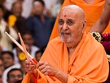  Swamishri plays with drum sticks