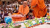 Swamishri plays with drum sticks