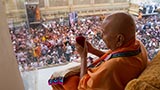  Swamishri sanctifies a ball of flowers