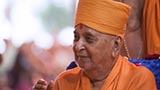 Swamishri in a divine, jovial mood