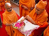  Swamishri sanctifies yantras to be placed beneath the murtis