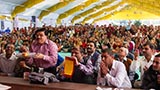 Devotees from Kolkata offer a decorated coconut to Swamishri, with an invitation to grace the Kolkata mandir with his presence