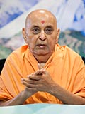  Swamishri joins sadhus in singing a kirtan