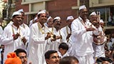 Devotees from Khandesh sing traditional kirtans before Swamishri