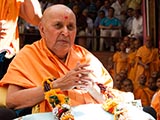  Swamishri is honored with a garland