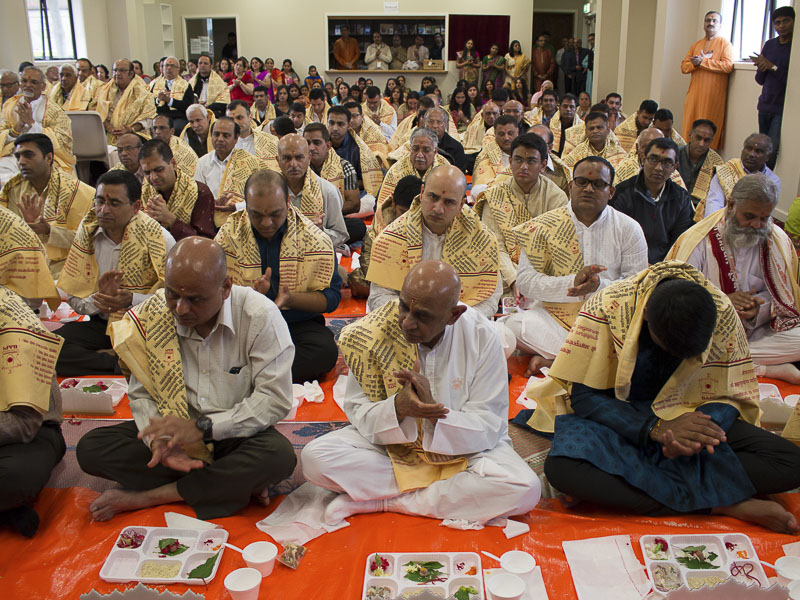 Devotees participate in murti-pratishtha mahapuja