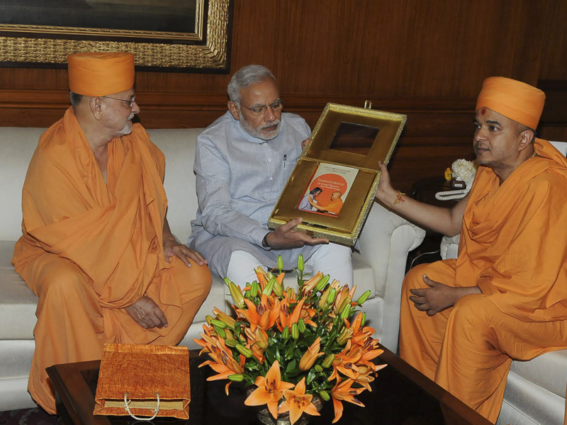 Sadhus present 'Transcendence' to Prime Minister Narendra Modi