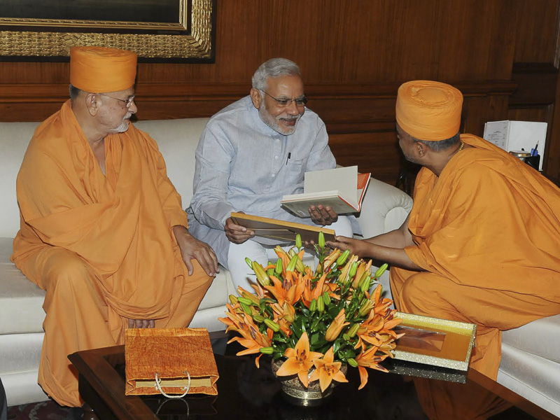 Sadhus present 'Transcendence' to Prime Minister Narendra Modi