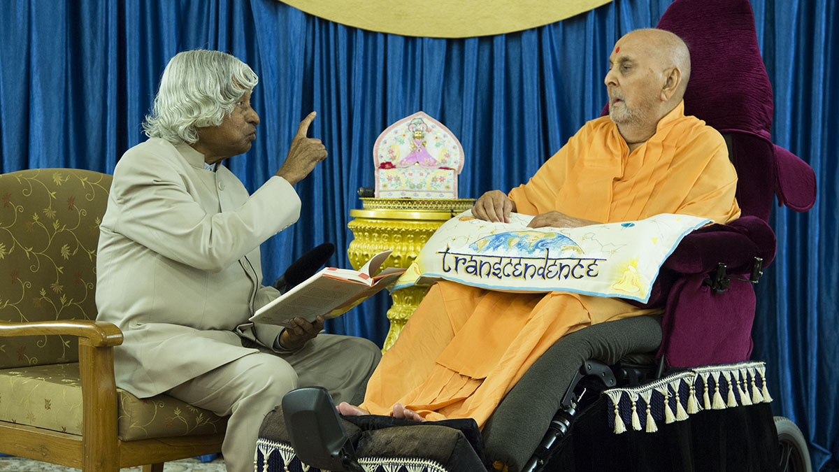 Dr. Kalam reads a part of his book 'Transcendence: My Spiritual Experiences with Pramukh Swamiji' before Pramukh Swami Maharaj, Sarangpur, 20 June 2015