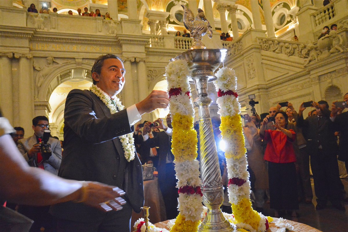 Rep. Ami Bera of California lighting the lamp as a part of the Diwali Celebration