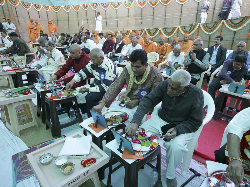 Devotees participate in mahapuja rituals