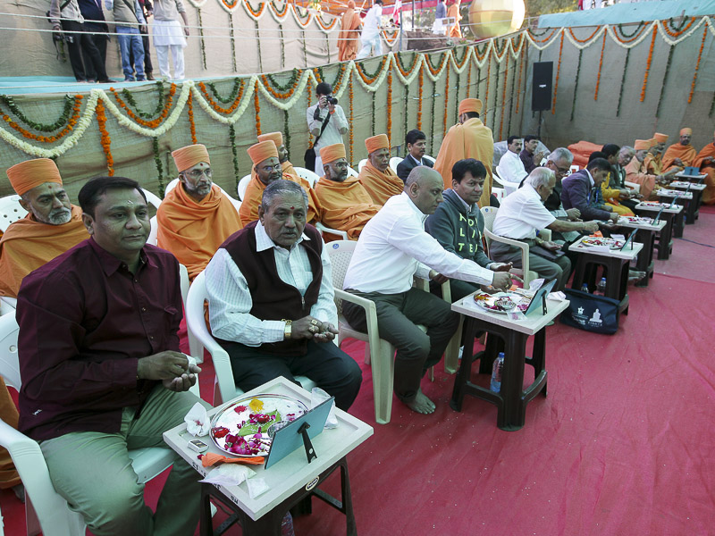 Devotees participate in mahapuja rituals