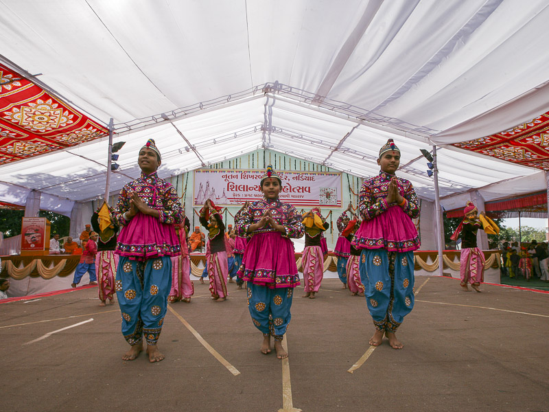 Children and youths perform a cultural dance