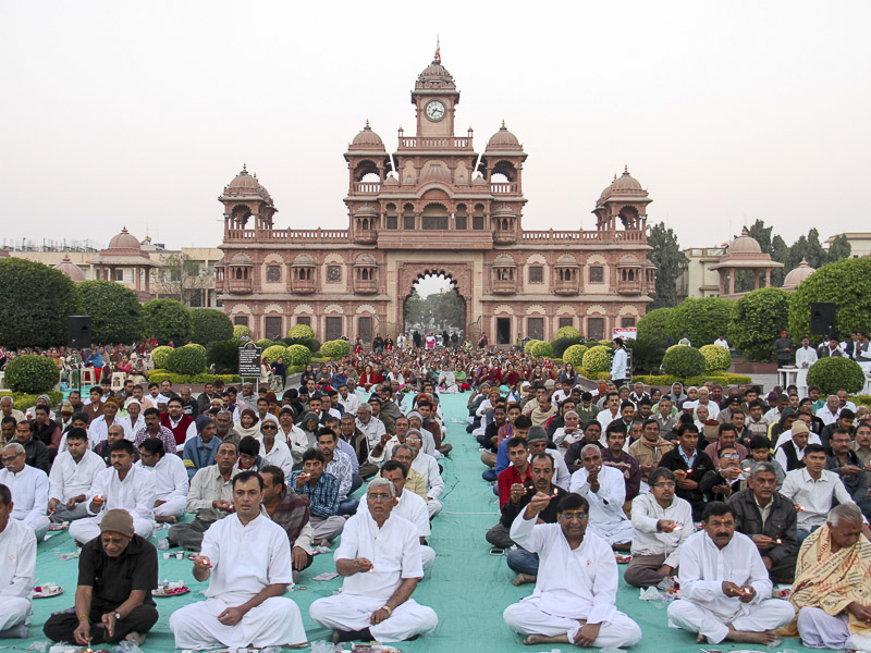 Devotees participate in mahapuja