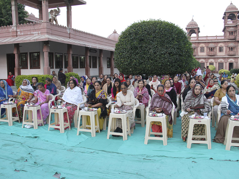 Devotees participate in mahapuja