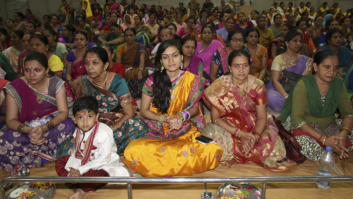 Mothers of the sadhaks participate in mahapuja rituals