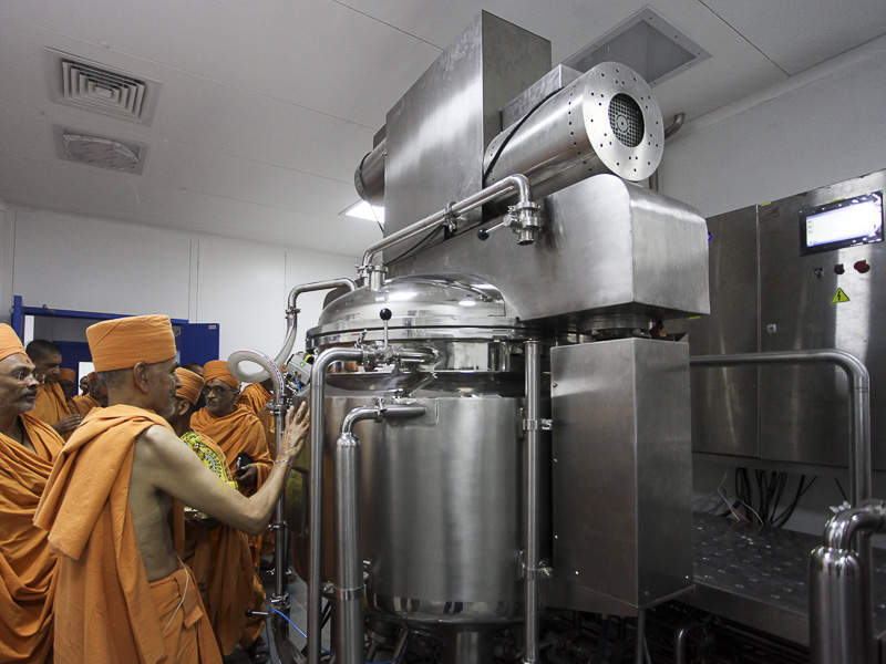 Senior sadhus sanctify toothpaste manufacturing machinery