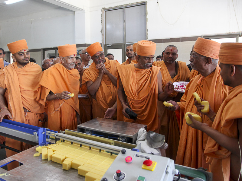 Senior sadhus sanctify soap manufacturing machinery