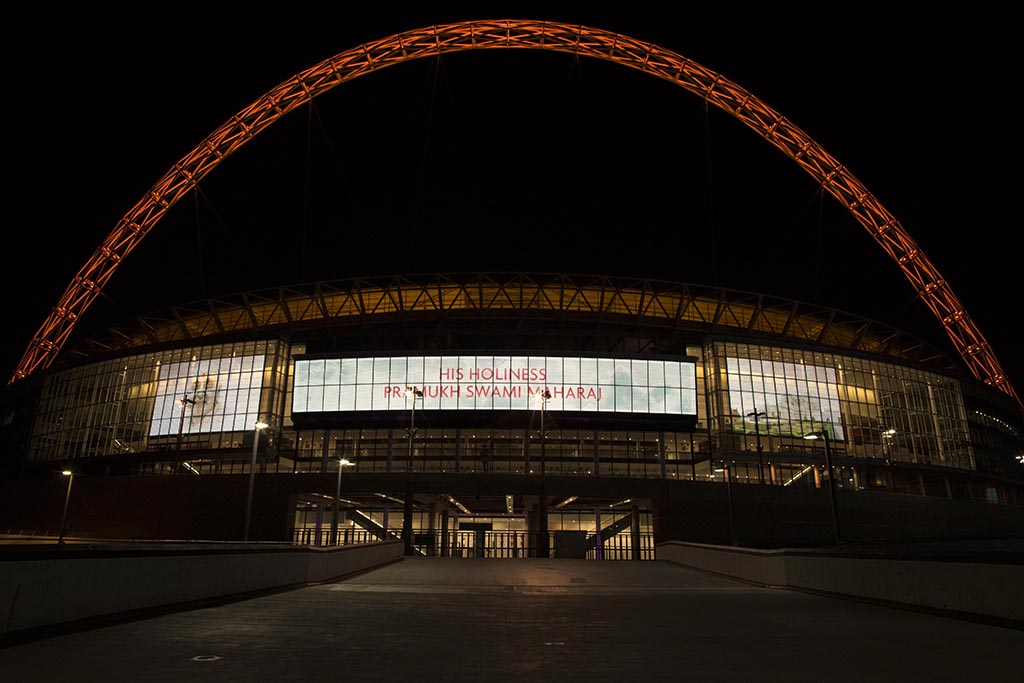 Wembley Stadium lit up its iconic arch in orange and featured a special message in honour of His Holiness Pramukh Swami Maharaj