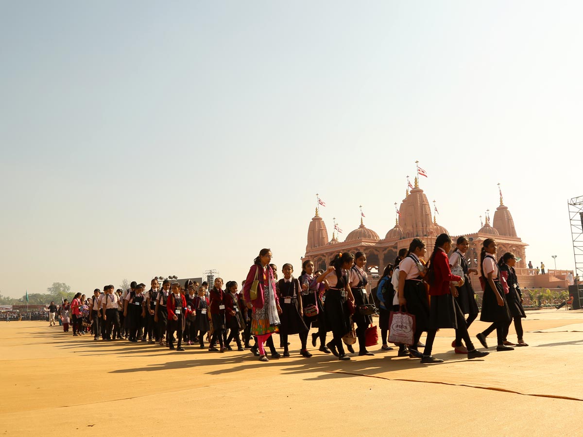 Students arrive to visit Swaminarayan Nagar