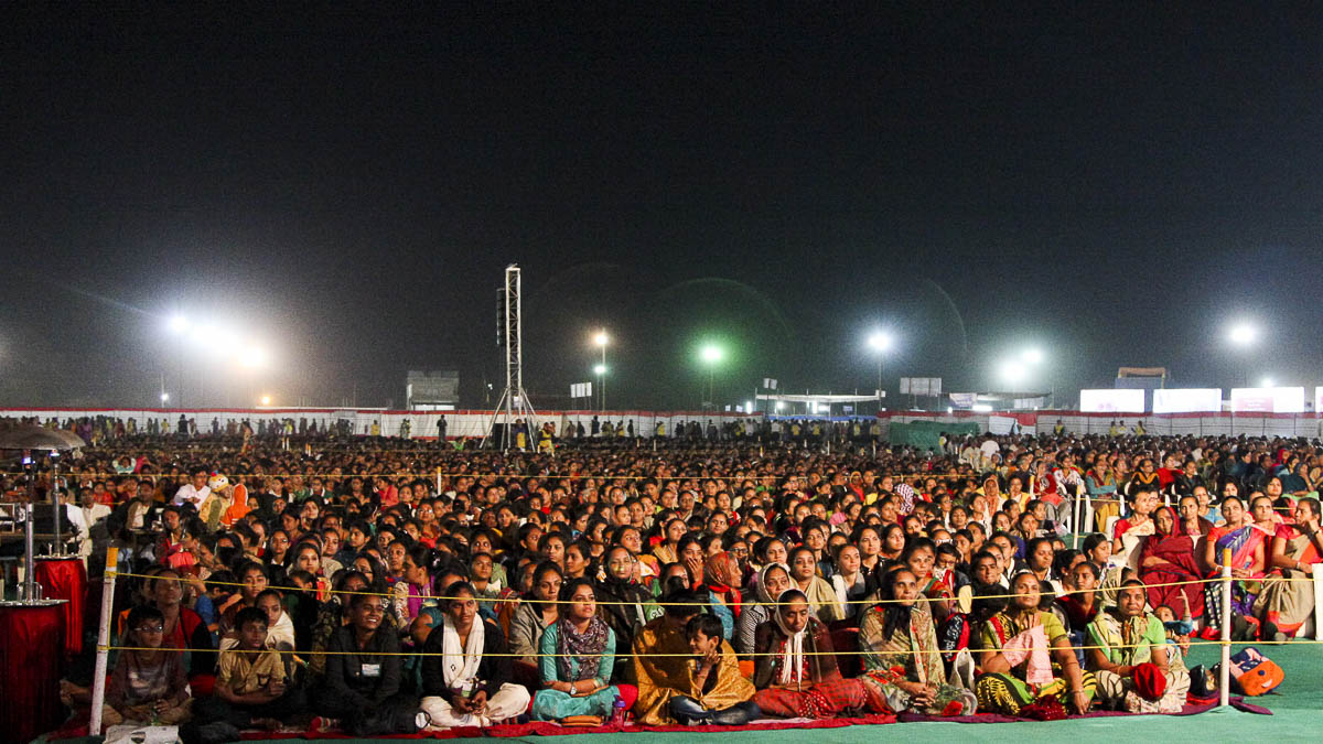 Devotees during the Mahila Din celebration assembly