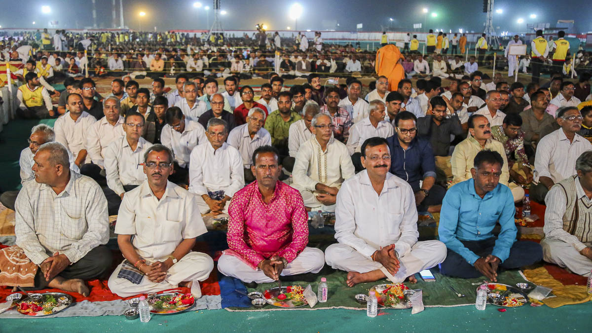 Fathers of the parshads participate in mahapuja rituals