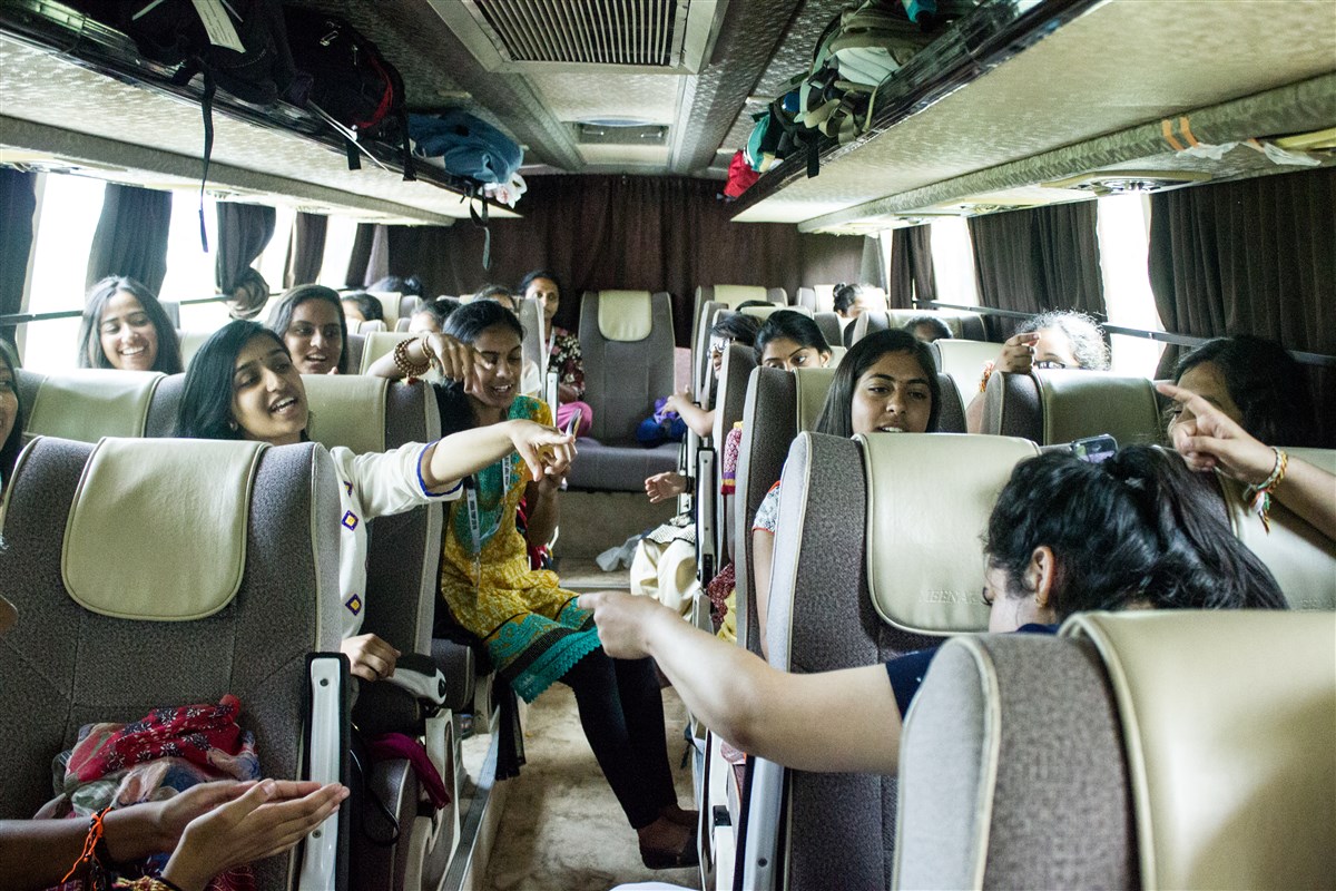 Singing bhajans and enjoying the bus travel