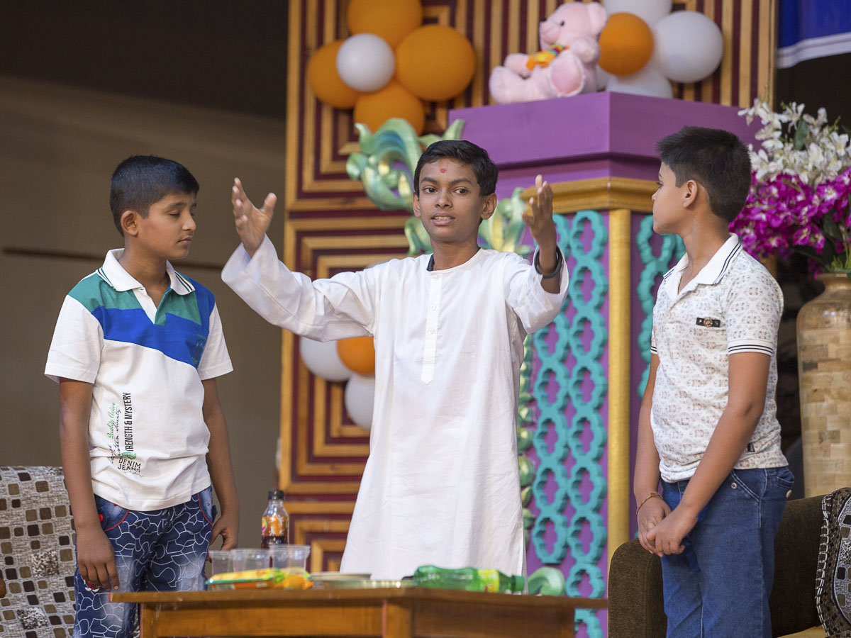 A skit presentation by children before Param Pujya Mahant Swami Maharaj in the evening satsang assembly, 21 Dec 2016