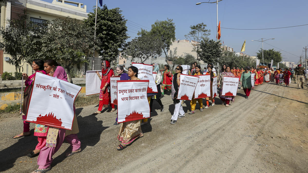 Women devotees participate in the procession