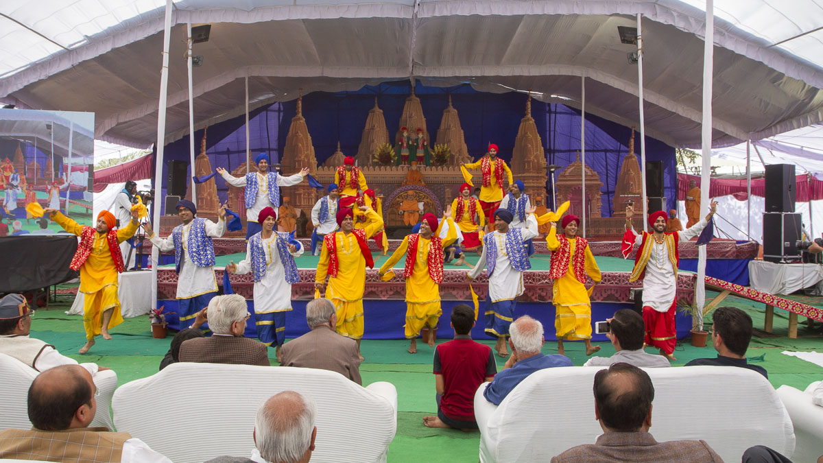 Youths perform a cultural dance in the assembly