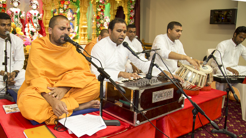Sadhus and youths sing kirtans in the satsang assembly